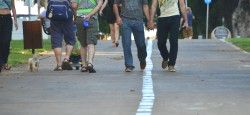 Gay couple holding hands on Ben Tsion Boulevard in Tel Aviv, Israel