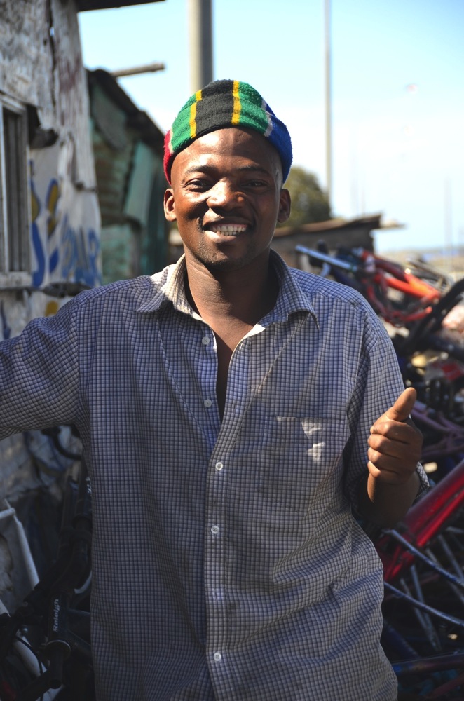 Ta Bong, pictured here, rehabilitates bicycles for children