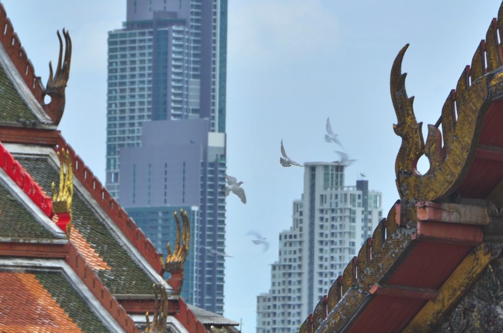 Looking back toward modern Bangkok from Wat Prayun puts the city's skyscrapers in an almost surreal context