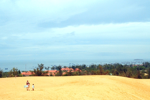 Sun yourself on the paved, erosion wrought beach of Mui Ne – then bike a few kilometers up the road to this massive sand dune