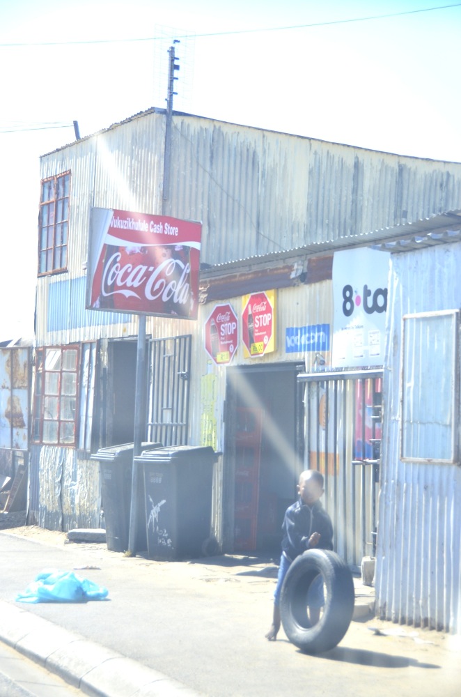 The clash of big brand names with the lives of Khayelitsha children is almost chilling