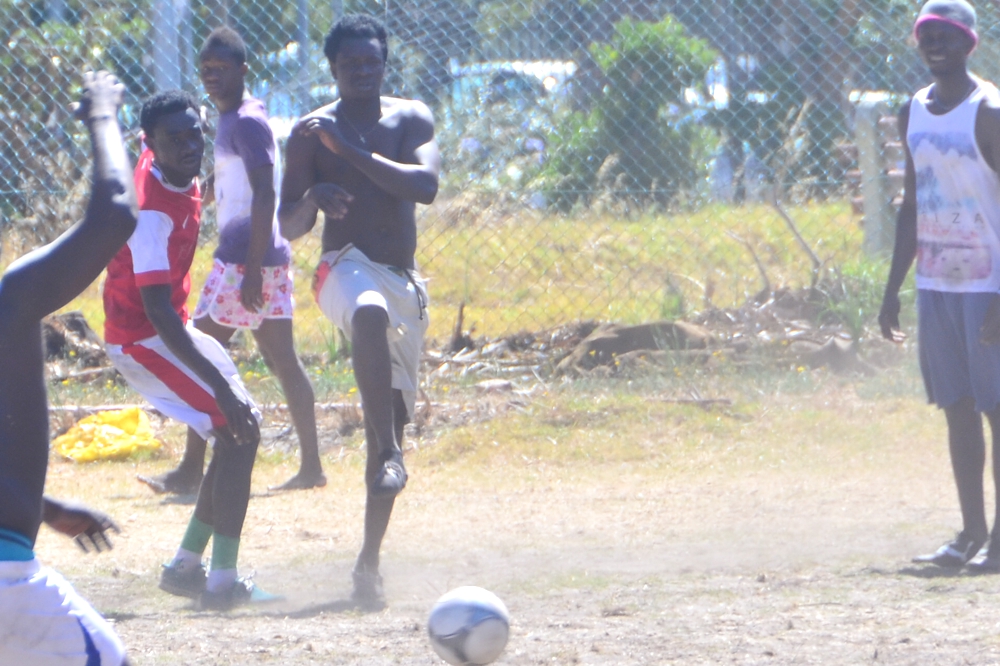 Catch a soccer game on the streets near Green Point