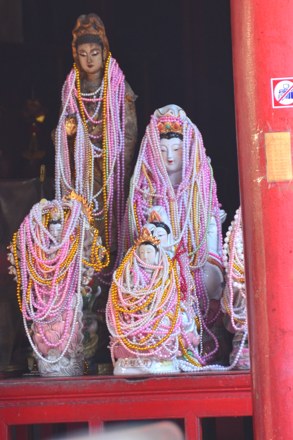 Bead-covered statues at the Wat Kudee Chinese Shrine