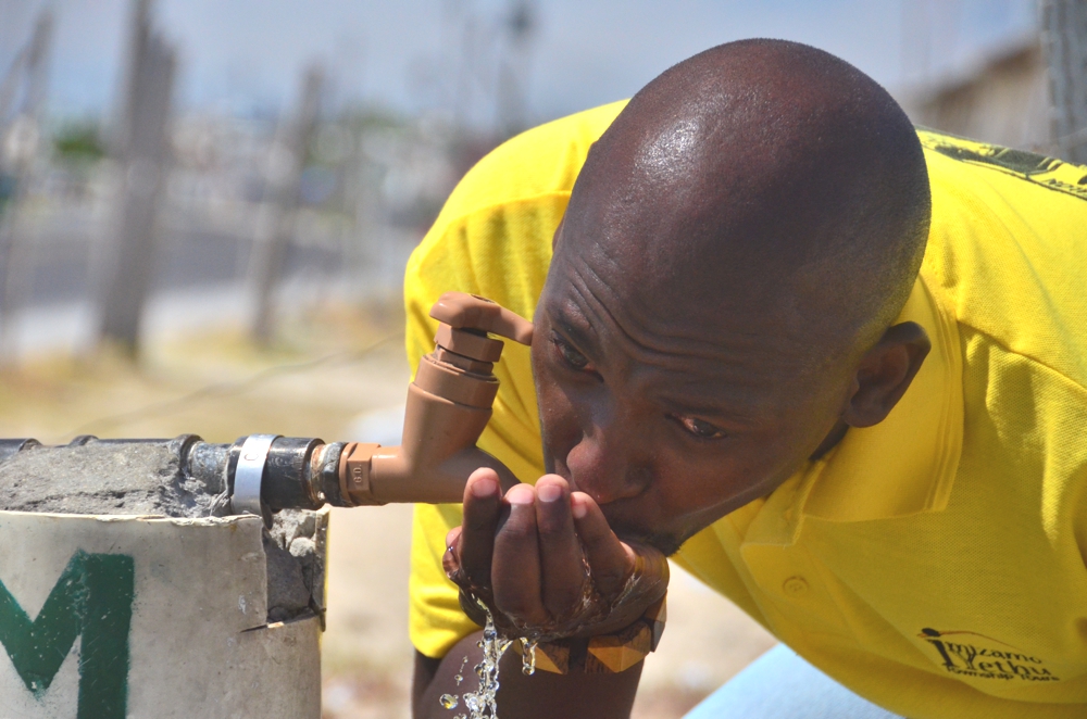 Khayelitsha thankfully has safe drinking water, as Mzu demonstrates