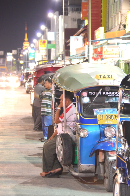 Travel through Thai cities and towns on a tuk tuk