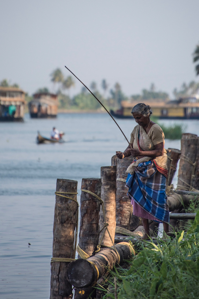 Woman fishing in Kerala, India